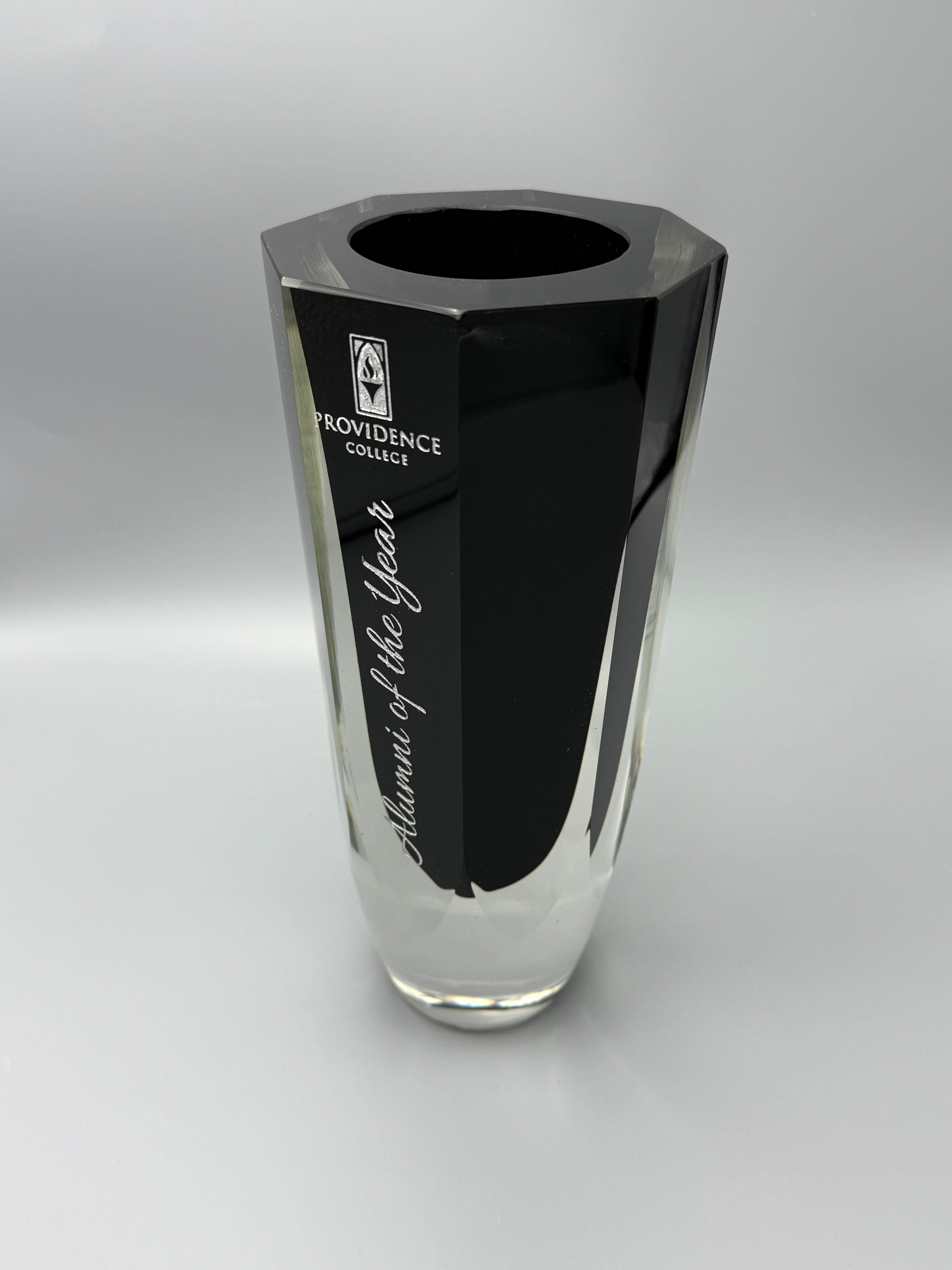 Clear glass vase with black background and engraved text and color filled