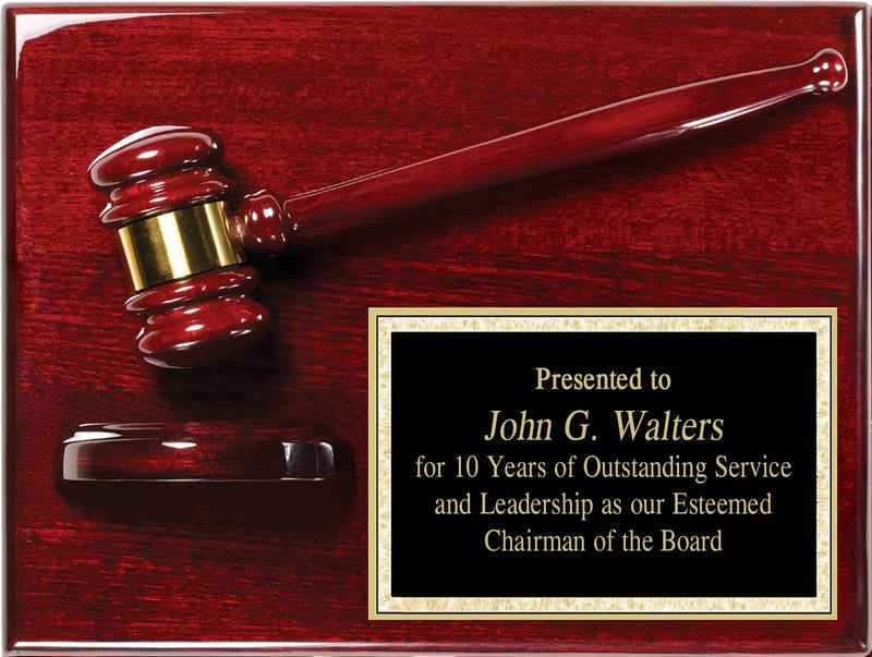 Wooden plaque with a gavel and engraved text on a rosewood plaque