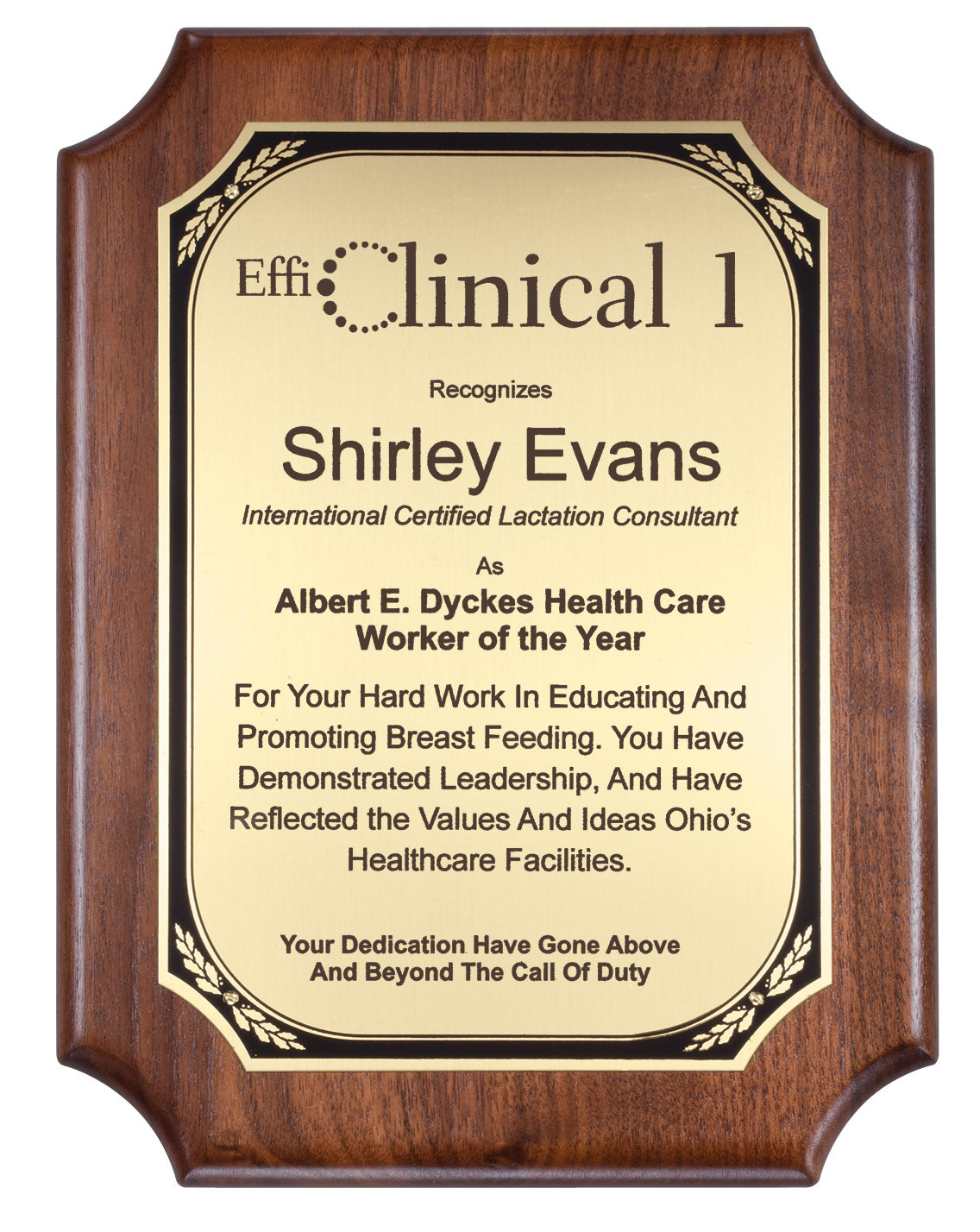 A personalized wooden plaque with a walnut wood frame and a gold brass plate featuring black text. 