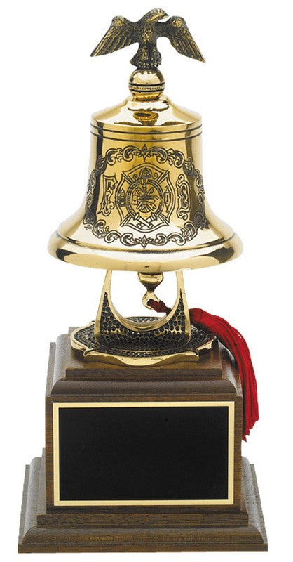 Firemans gold bell with cast eagle on top on a wooden base