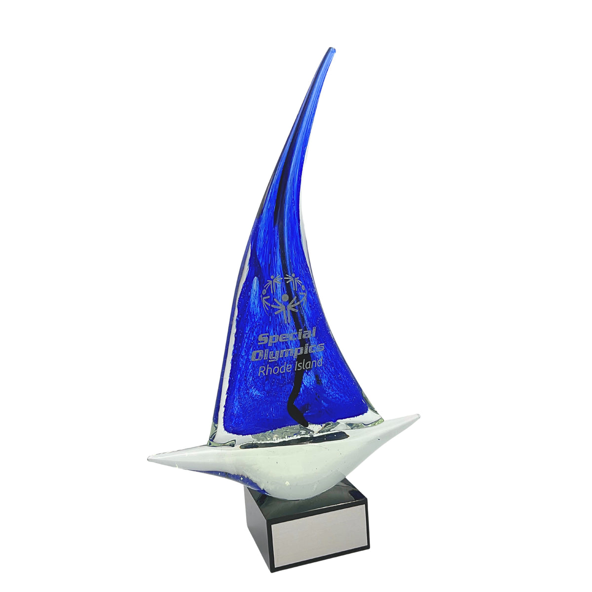 A unique art glass sail boat with a blue sail, mounted on a solid black marble base.