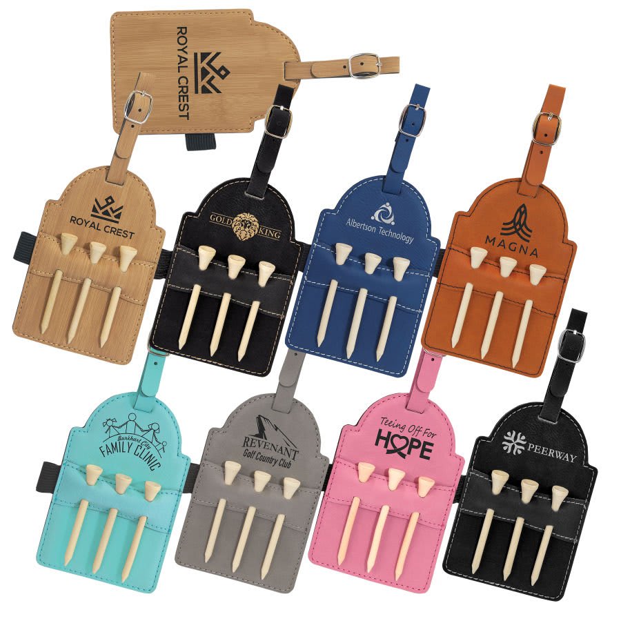 A collection of laserable leatherette golf bag tags in various colors, each featuring three wooden tees, displayed on a white background.