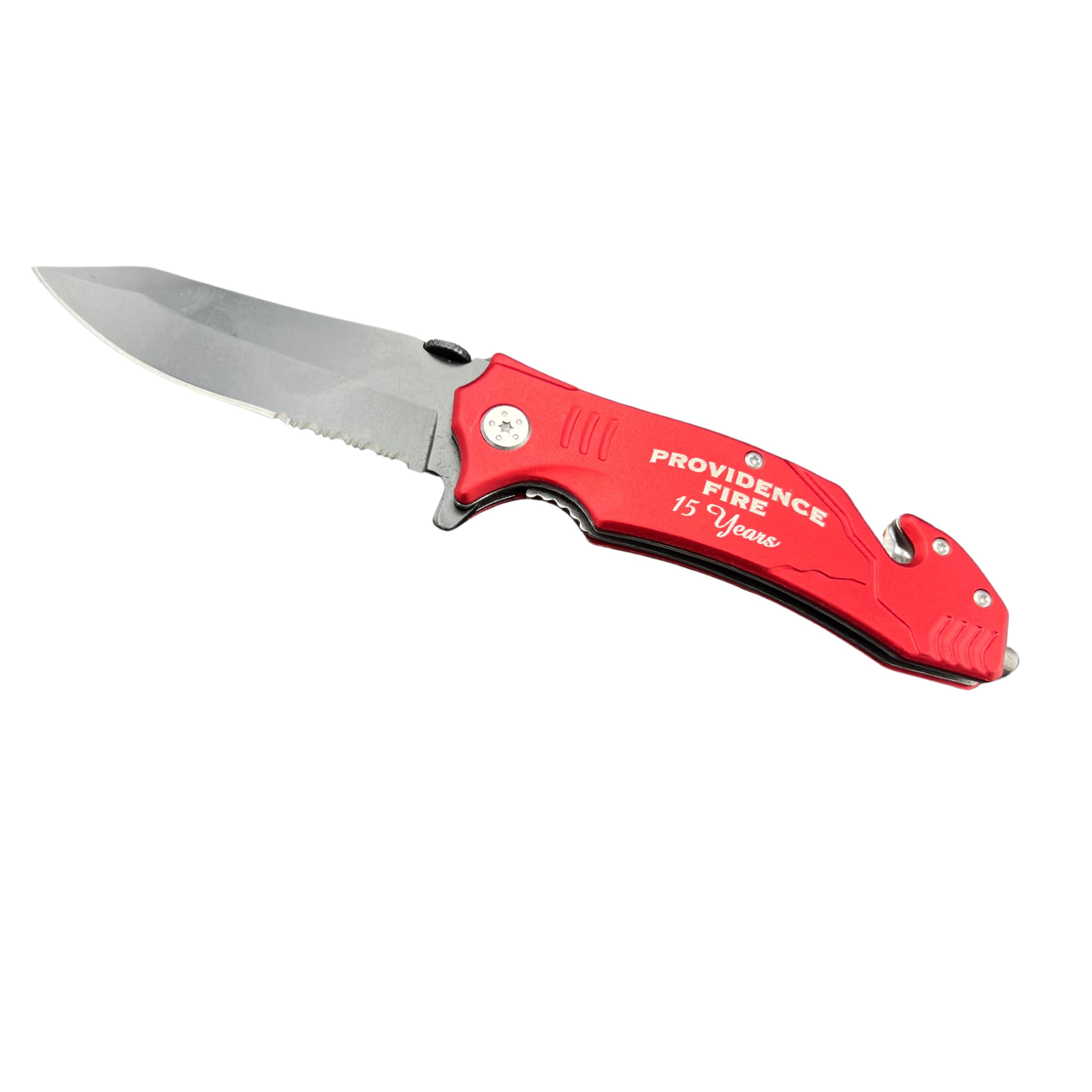 Red metal rescue knife engraved on handle