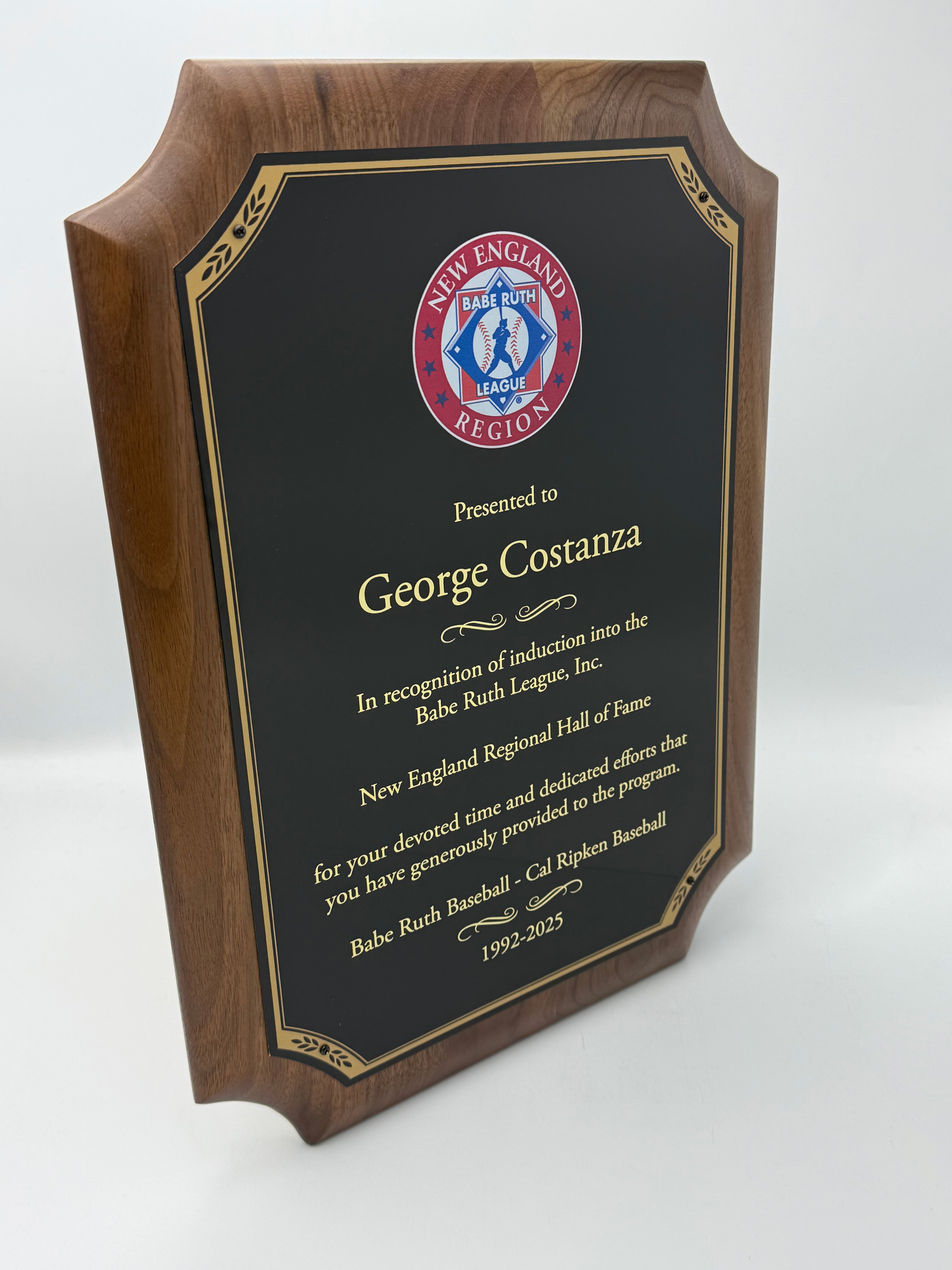 Walnut plaque with black brass plate , lettering and full color logo