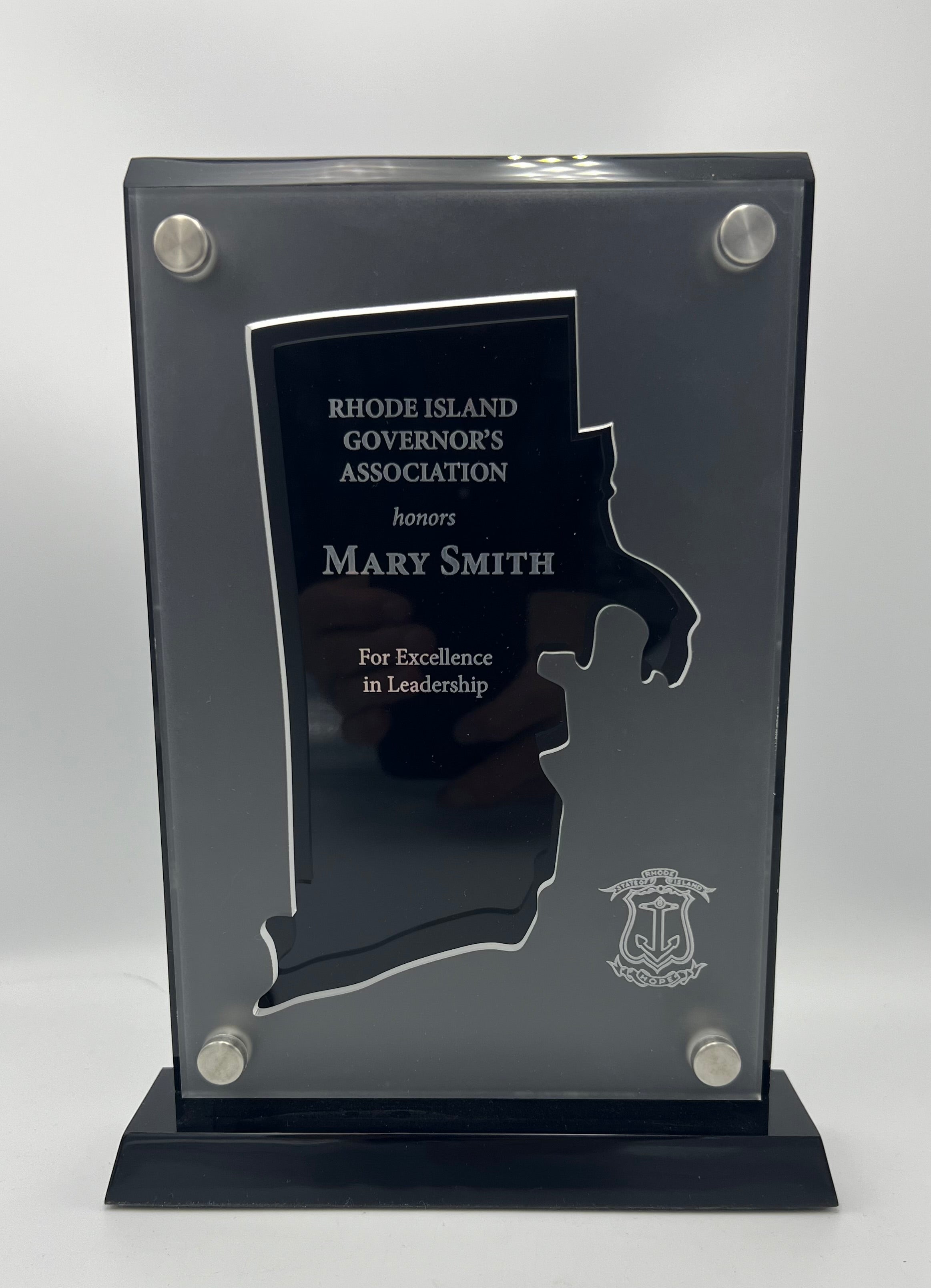 Black and frost acrylic award with cut out shape of rhode ISland
